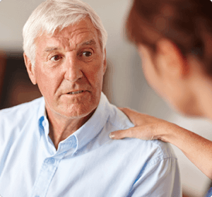 occupational mediicne worker talking to older man