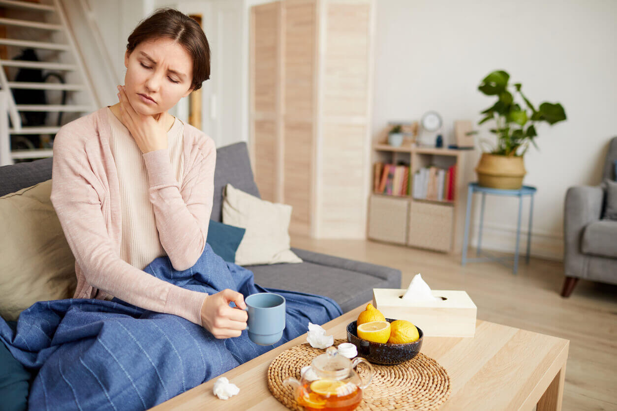 Woman has a sore throat.